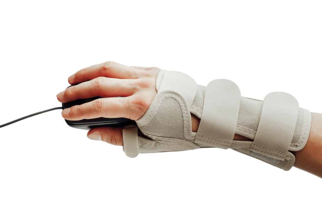 wearing a wrist brace whilst working at a computer 