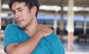 man suffer from stiff shoulder, muscle inflammation