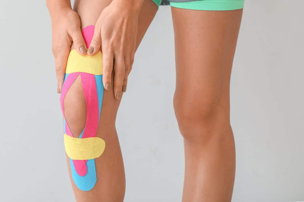 Woman with Knee Kinesiology tape