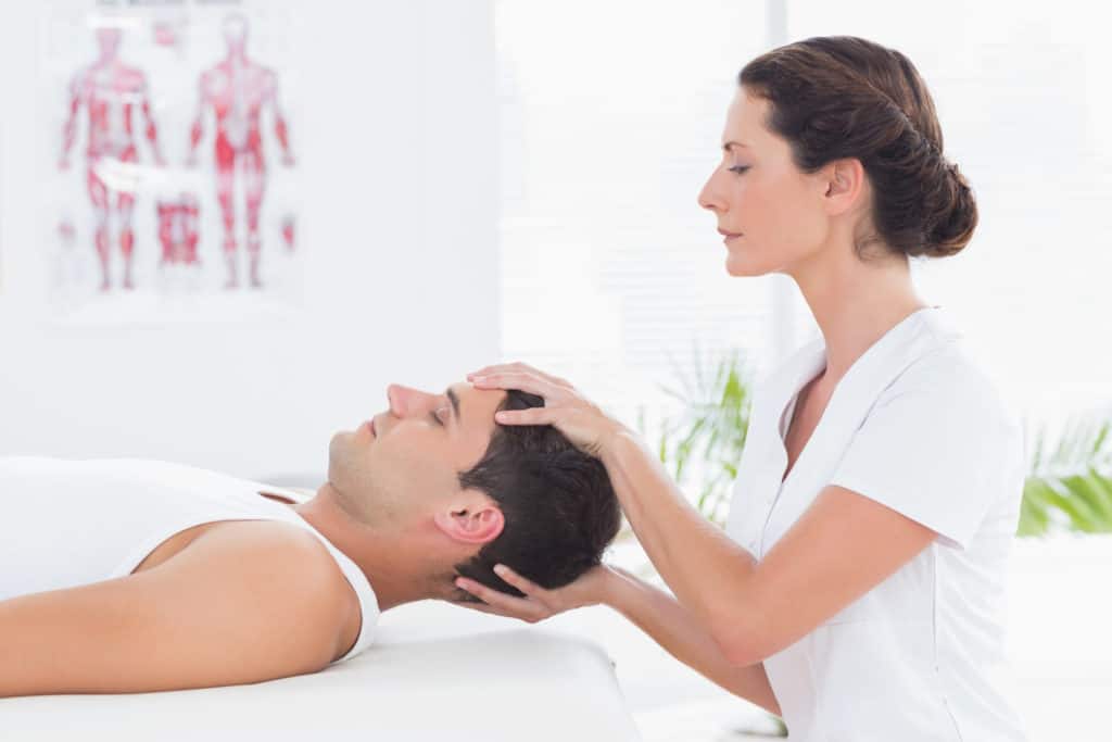 man receiving physical therapy for his neck pain 