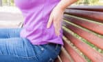 Do you have an Aching Back? - Woman with low back pain Fotolia 95795910