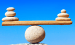 rocks balancing on top of each other to form a scale