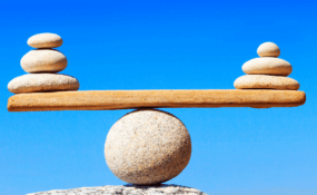 rocks balancing on top of each other to form a scale
