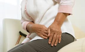 Hip pain of senior woman after waking up