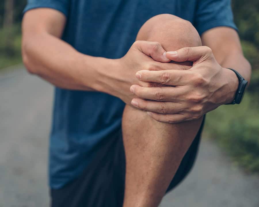 Avoiding Overuse Injuries: Sports Physical Therapy Tips for Foothill Ranch Athletes - runner stretching hamstring