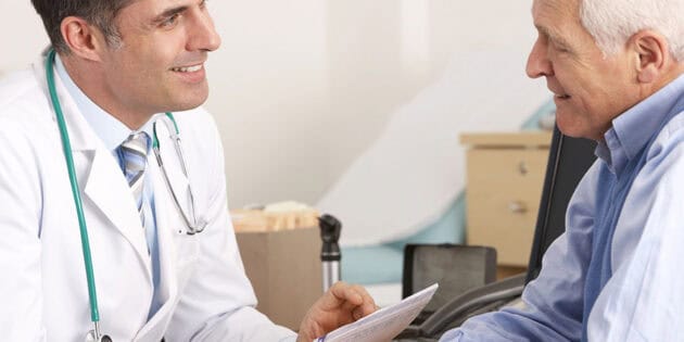 doctor talking to senior man about surgery