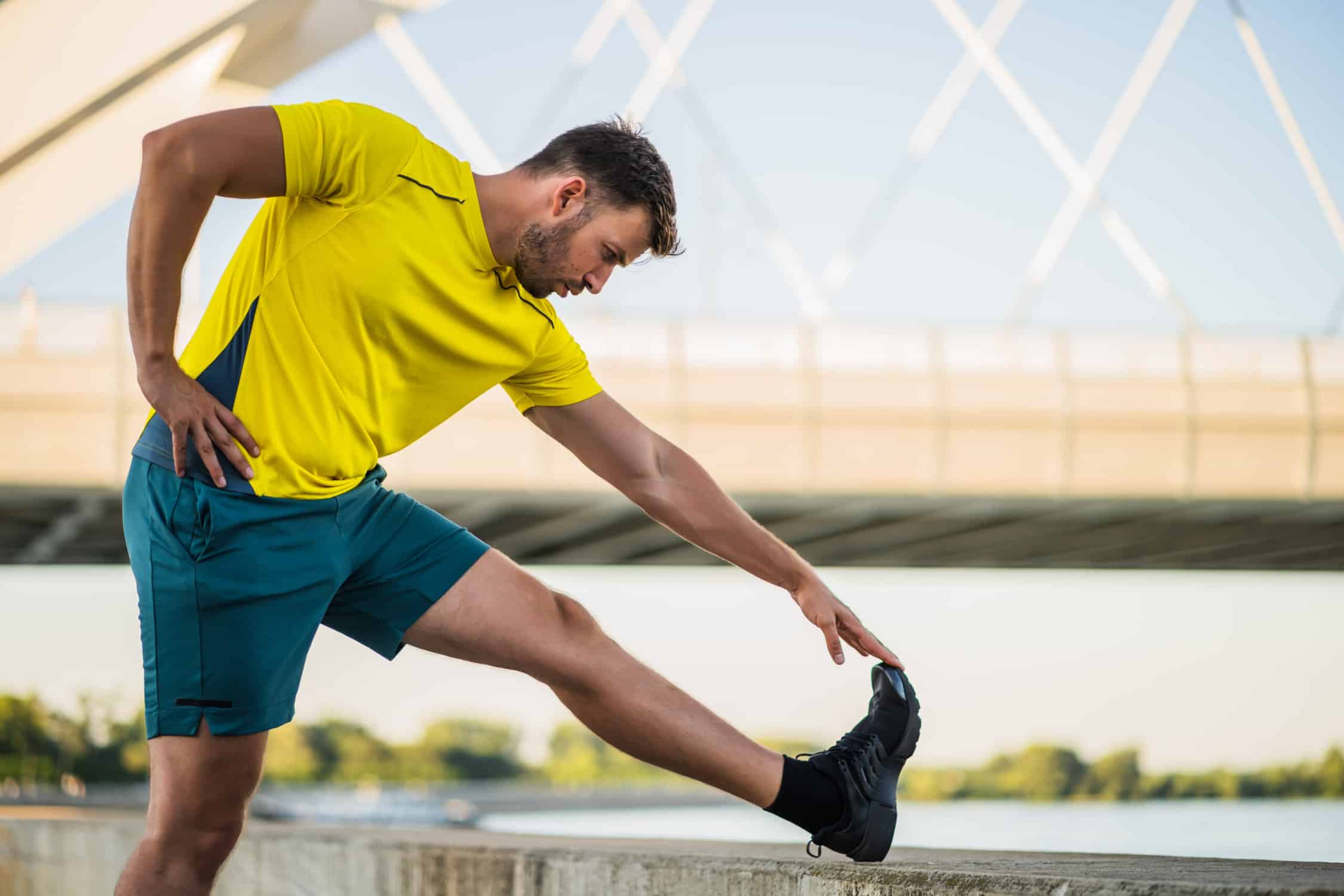 man doing runners knee stretches