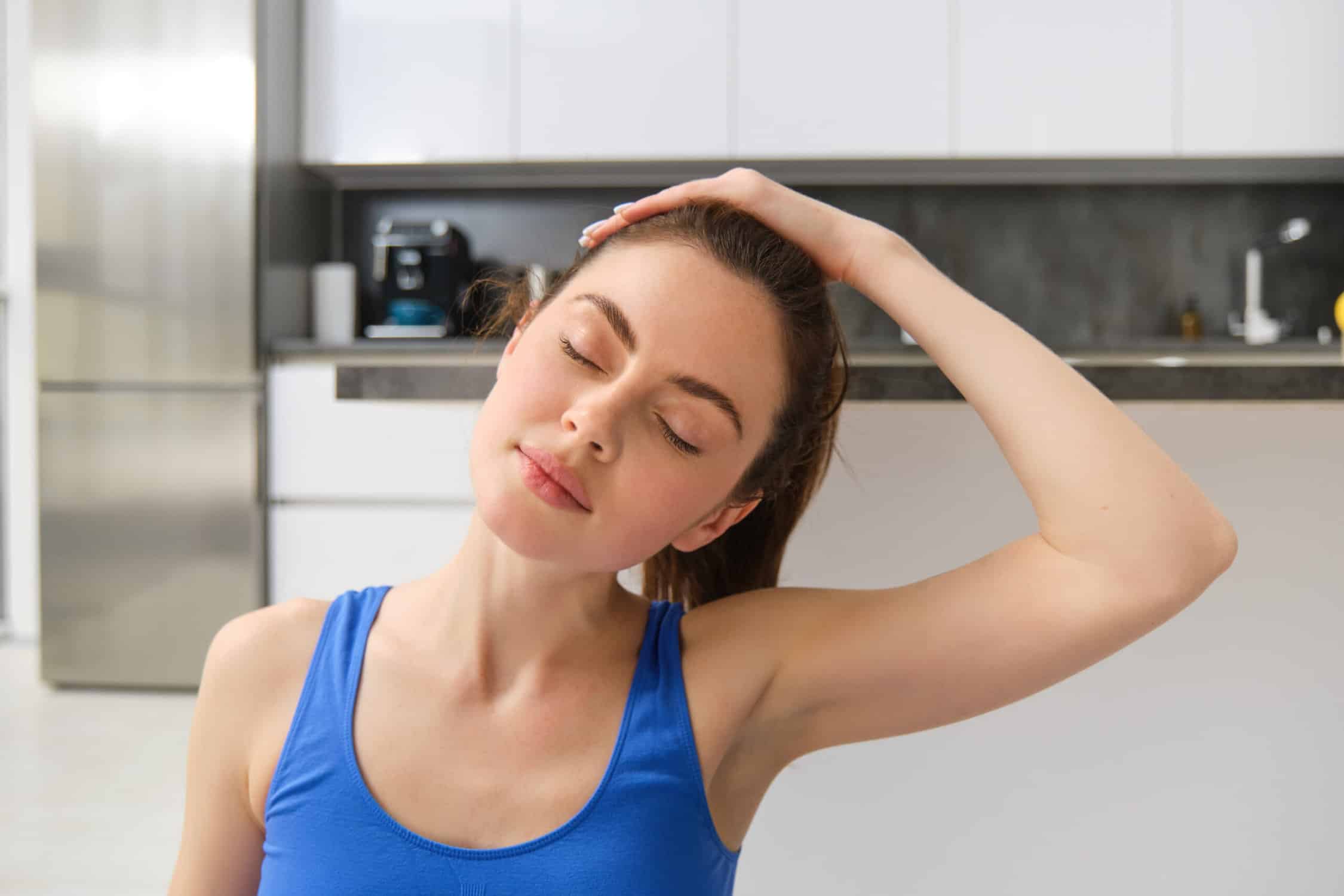 girl doing neck stretch to avoid common posture problems