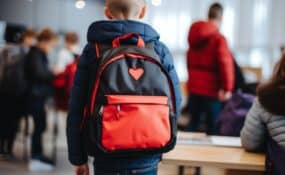 red and black child's backpack at school