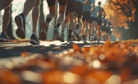 a group of people running on a road for turkey trot