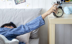man in bed getting hours of sleep