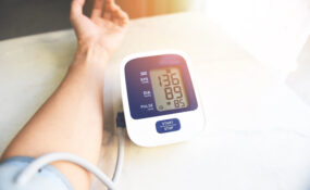 Man checking his blood pressure with a blood pressure cuff