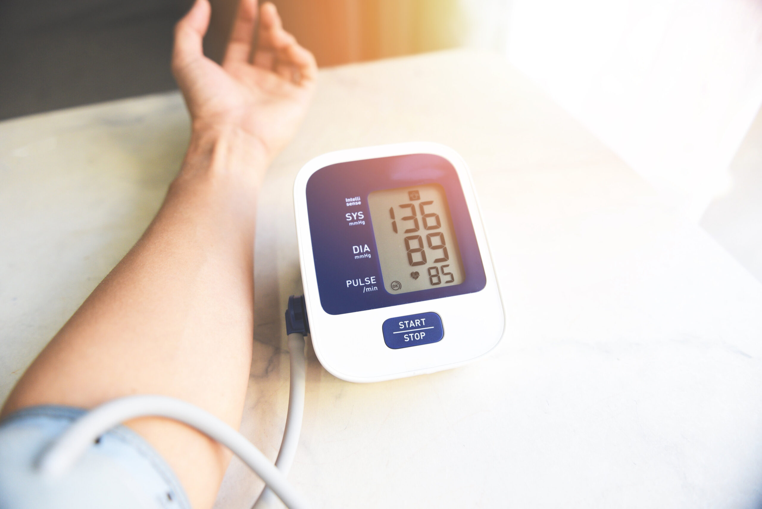 Man checking his blood pressure with a blood pressure cuff