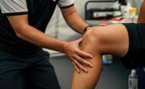 Physical therapist guiding athlete through ACL reconstruction rehabilitation at Intecore Physical Therapy Southern California