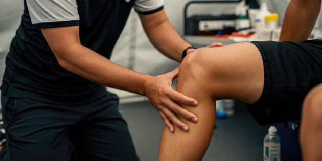 Physical therapist guiding athlete through ACL reconstruction rehabilitation at Intecore Physical Therapy Southern California