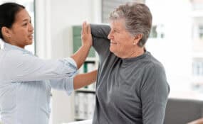 Physical therapist treating patient shoulder rotator cuff rehabilitation at Intecore Physical Therapy Southern California