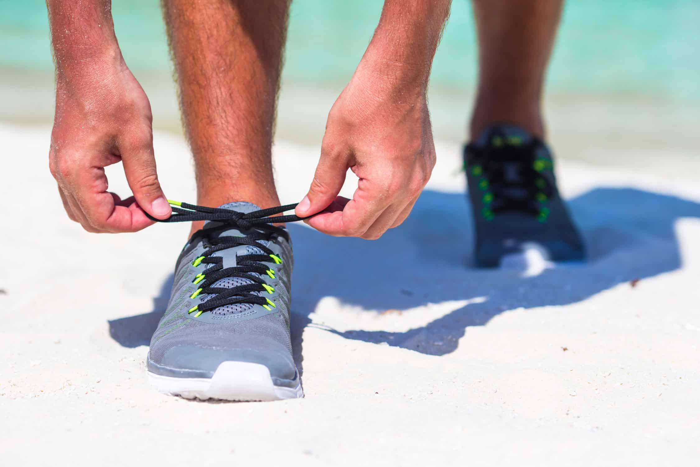 man with beach running shoes