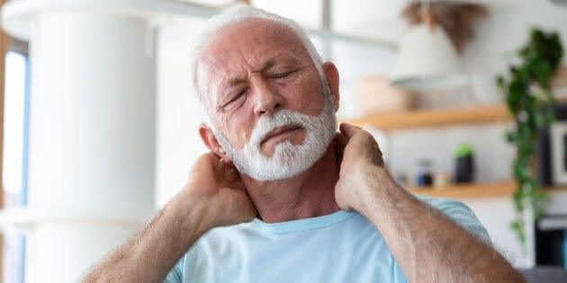 elderly man suffering from morning neck pain