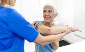 Physical therapist guiding patient through shoulder replacement rehabilitation at Intecore Physical Therapy Southern California