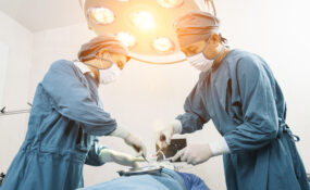 a group of surgeons performing surgery