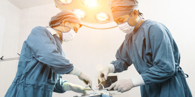 a group of surgeons performing surgery