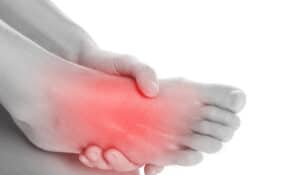 woman suffering with neuropathy in the foot