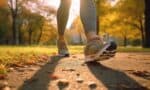 a person's legs walking on a path foot tendonitis