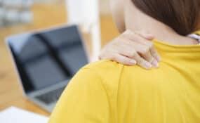 woman with Pain Between Shoulder Blade
