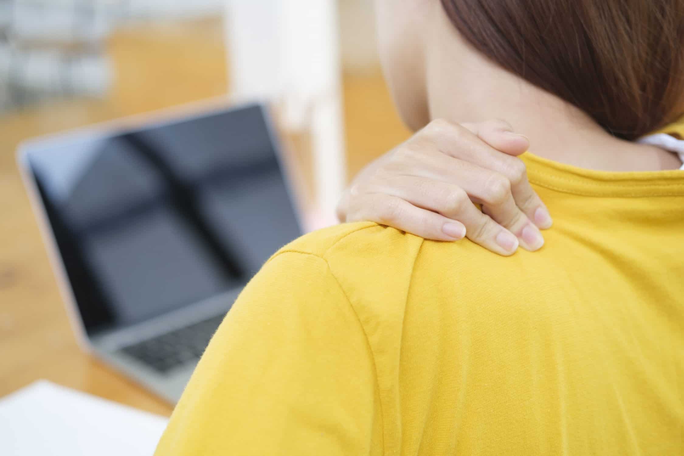 woman with Pain Between Shoulder Blade