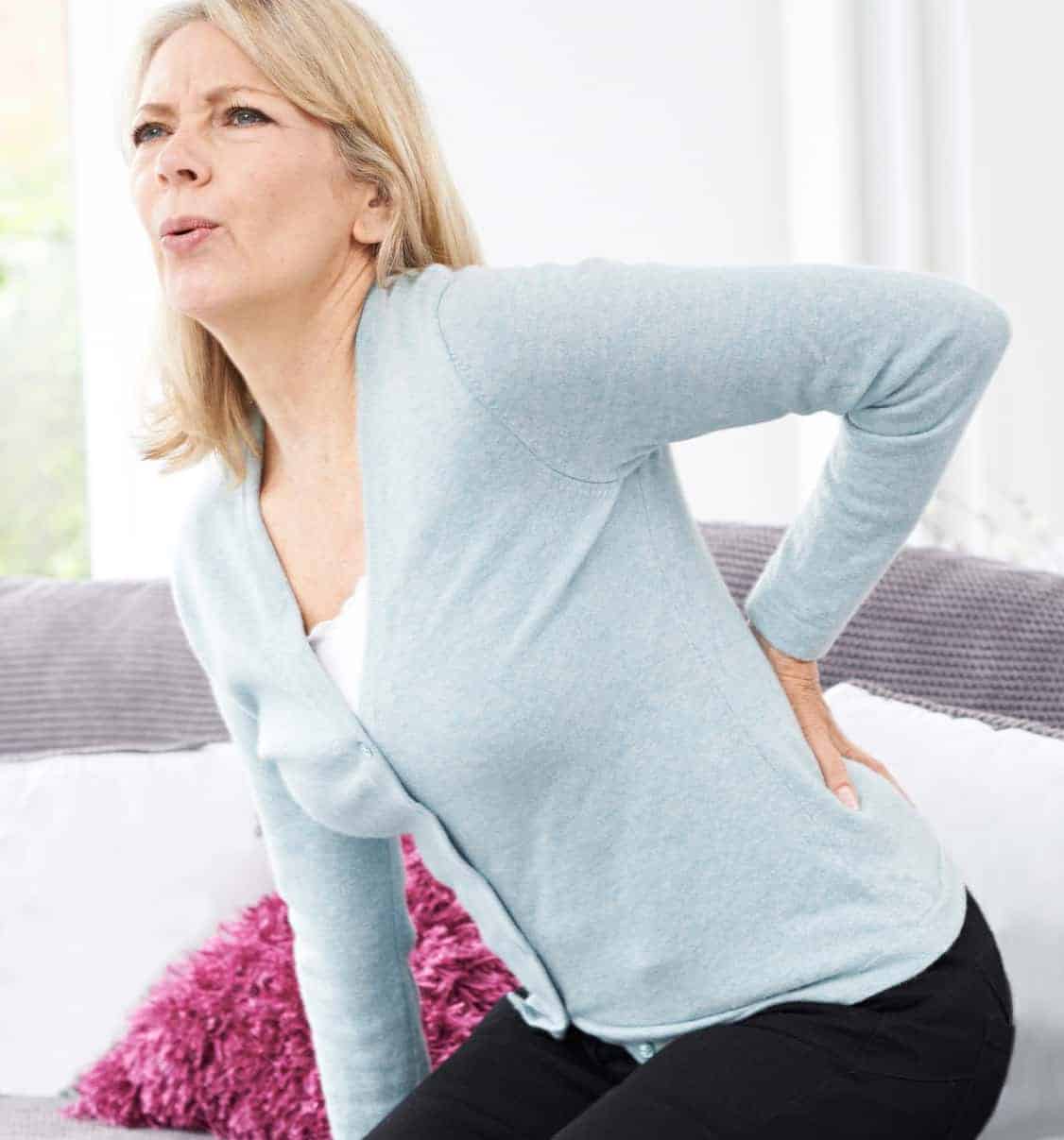 Simple Exercises For Sciatica Pain - woman chair back pain